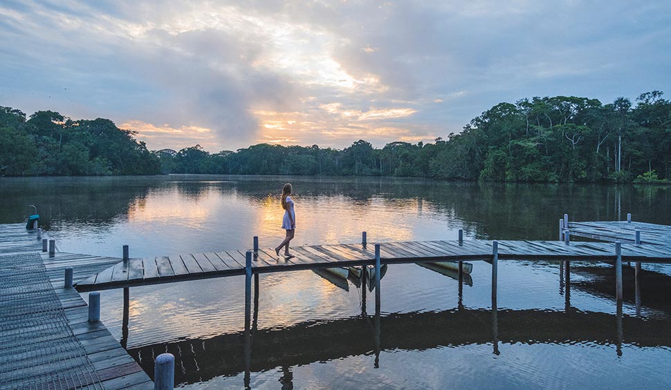 woman walking on the pier - la selva lodge